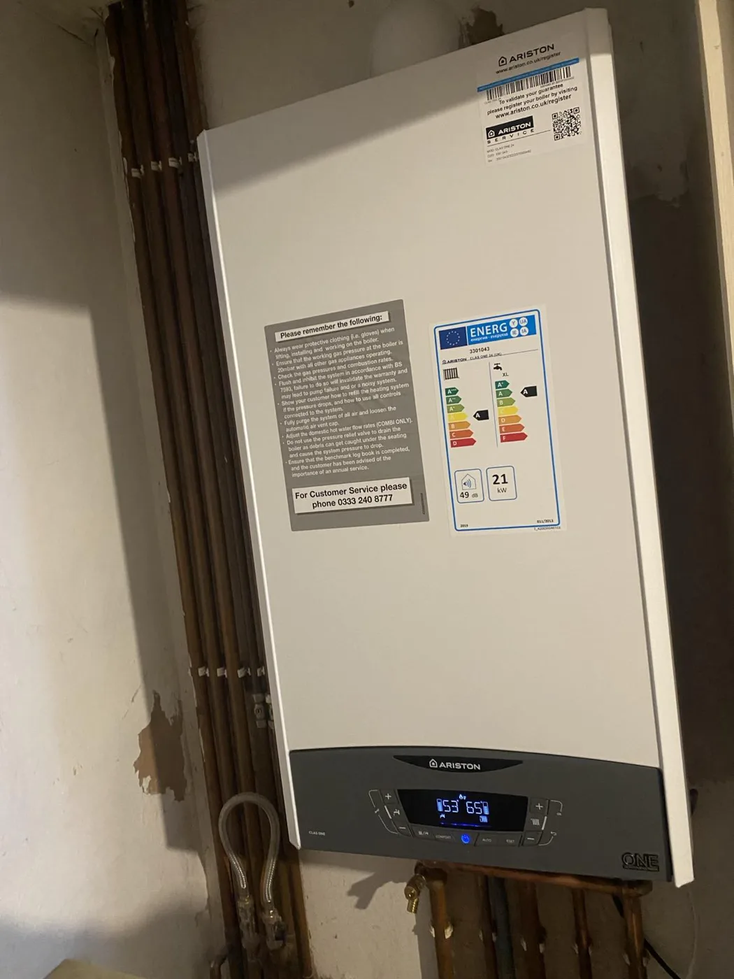 Wall-mounted combi boiler installation